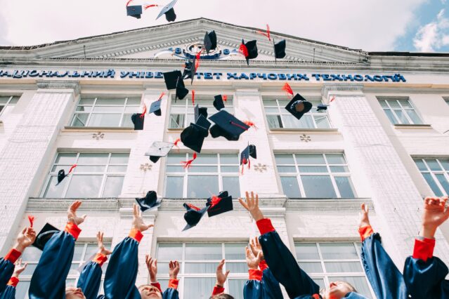 university caps being thrown into the air