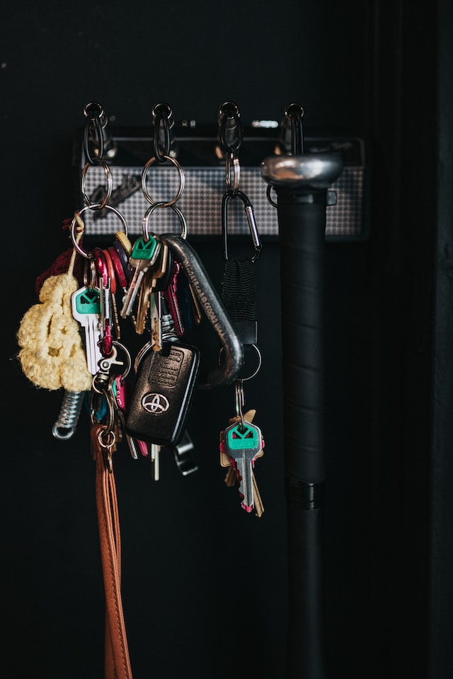 House and car keys hanging up in house