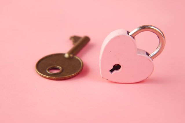 Locksmith Service: Pink padlock and key for Home Security